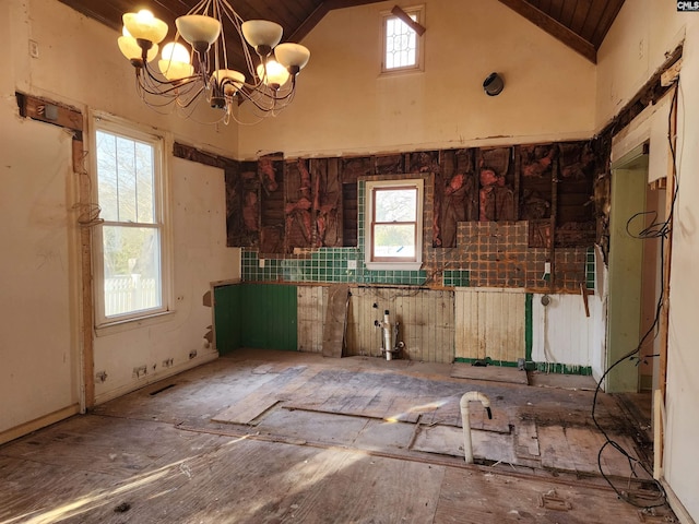 misc room with a notable chandelier, wood ceiling, and high vaulted ceiling