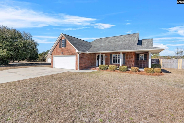 view of front of home featuring a garage and a front yard