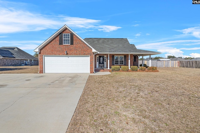 view of front of property with a garage, a porch, and a front lawn