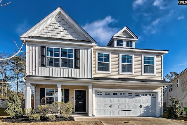 view of front facade with a garage and covered porch