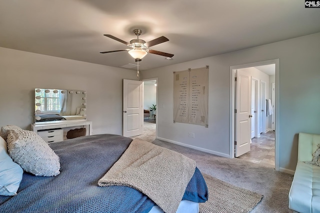 bedroom featuring light carpet and ceiling fan