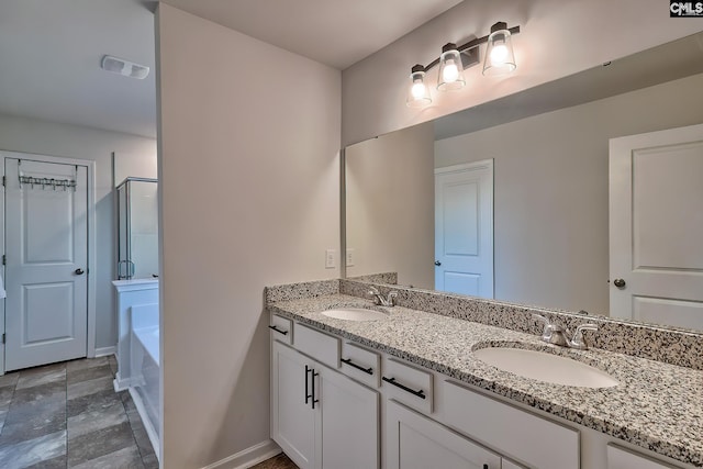 bathroom featuring vanity and shower with separate bathtub