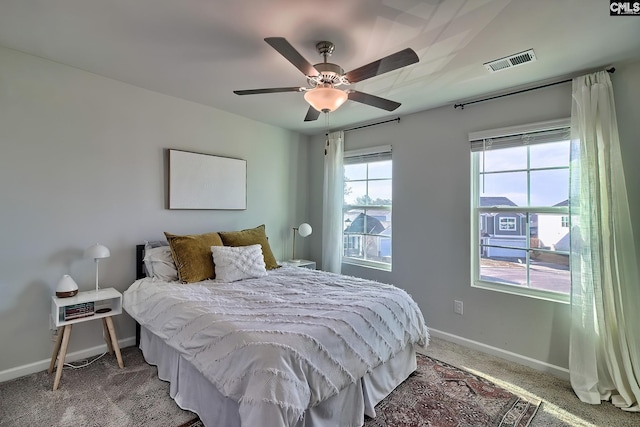 bedroom with ceiling fan and carpet flooring