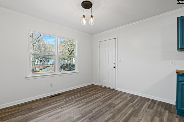 unfurnished dining area with crown molding and dark hardwood / wood-style floors