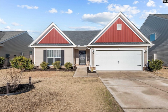 view of front of property featuring a garage and a front lawn