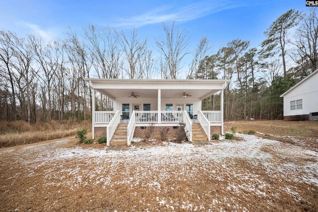 view of front of home featuring ceiling fan and a porch