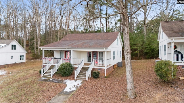 view of front of home featuring a porch and central air condition unit