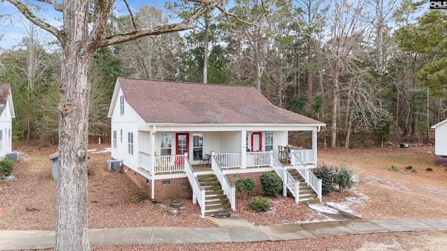 view of front facade featuring central AC and covered porch