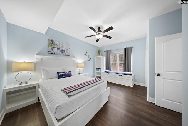 bedroom with dark hardwood / wood-style floors and ceiling fan