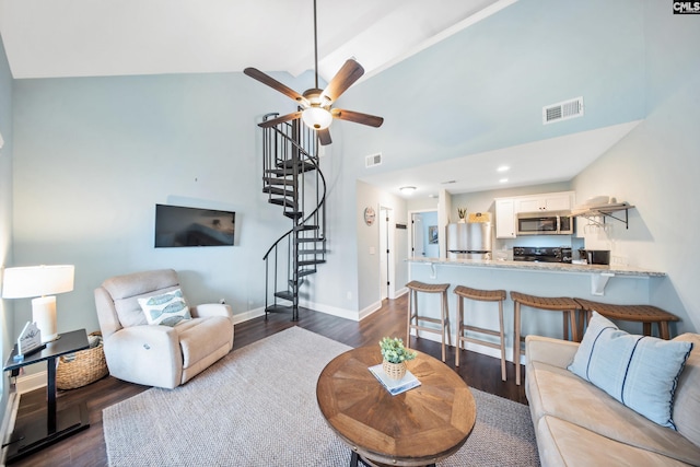 living room featuring high vaulted ceiling, dark wood-type flooring, and ceiling fan