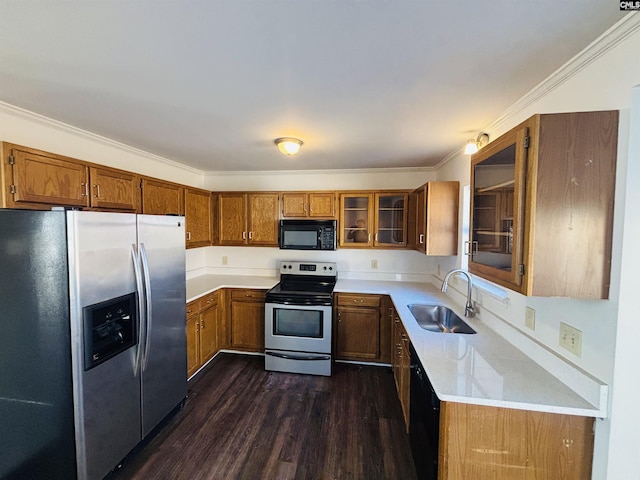 kitchen with sink, crown molding, dark hardwood / wood-style floors, light stone counters, and black appliances