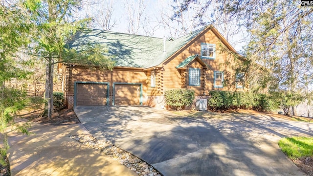 cabin featuring a garage