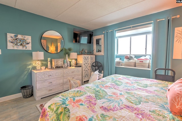 bedroom with wood-type flooring