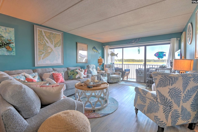 living room featuring hardwood / wood-style floors and a textured ceiling