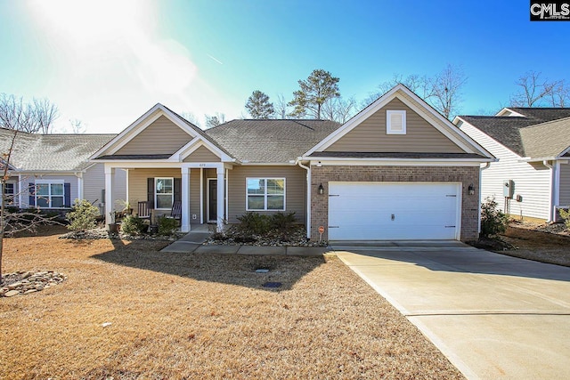 view of front of property featuring a garage and a porch