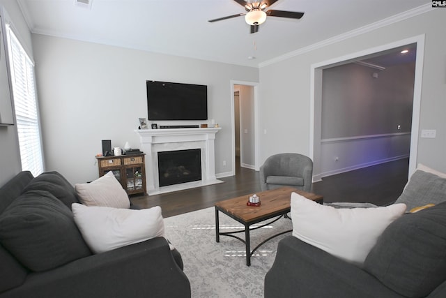 living room featuring ornamental molding, dark hardwood / wood-style floors, and ceiling fan