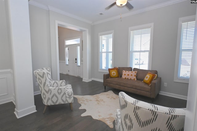 living room featuring crown molding, ceiling fan, and dark wood-type flooring