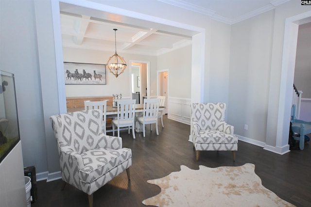 sitting room with dark wood-type flooring, beam ceiling, coffered ceiling, a notable chandelier, and ornamental molding