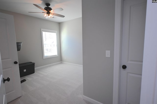 interior space featuring ceiling fan