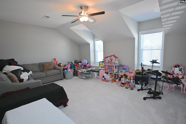 recreation room featuring lofted ceiling, ceiling fan, and carpet flooring