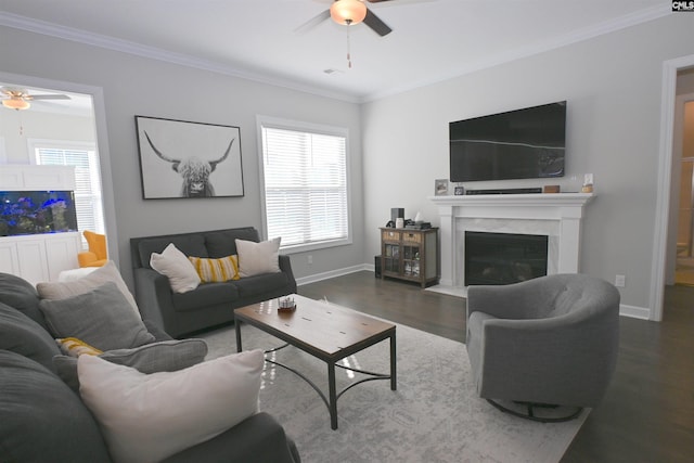 living room featuring ornamental molding, dark wood-type flooring, and ceiling fan