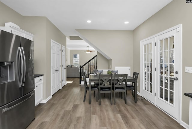 dining area with hardwood / wood-style floors and ceiling fan