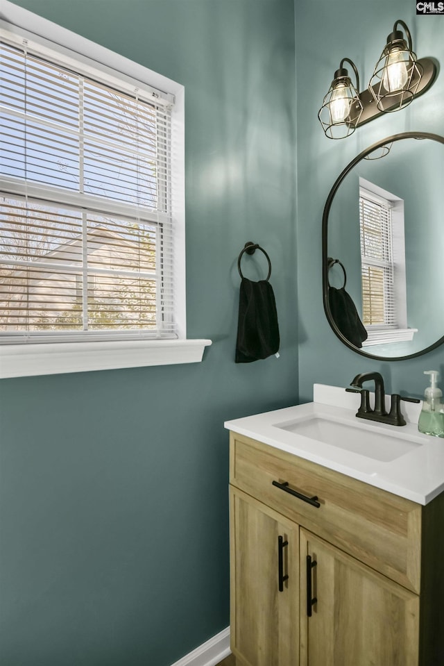 bathroom featuring vanity and a healthy amount of sunlight