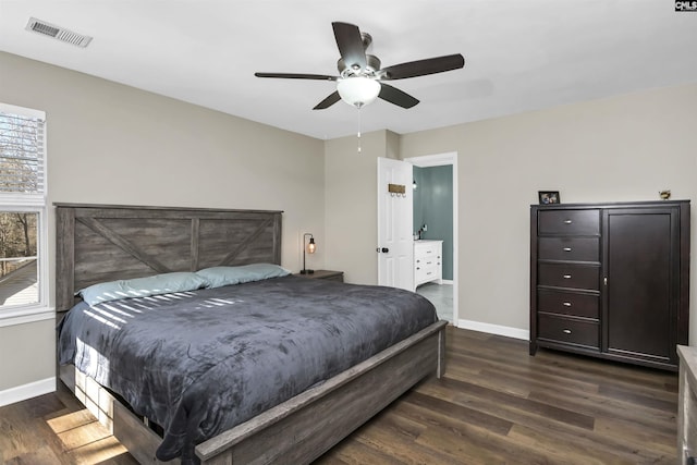 bedroom with dark hardwood / wood-style floors and ceiling fan