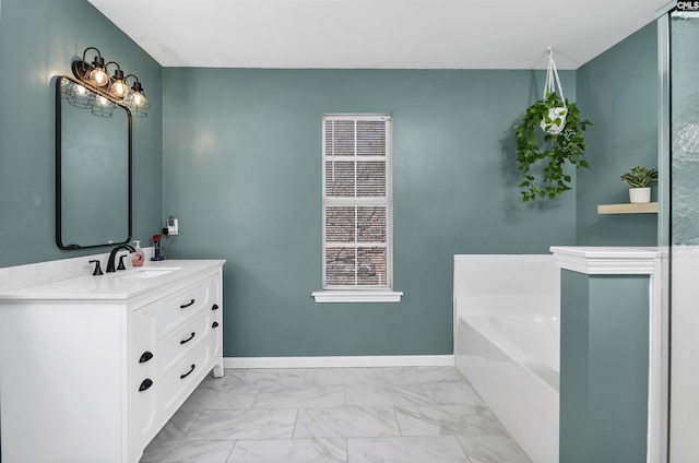 bathroom featuring vanity and a tub to relax in