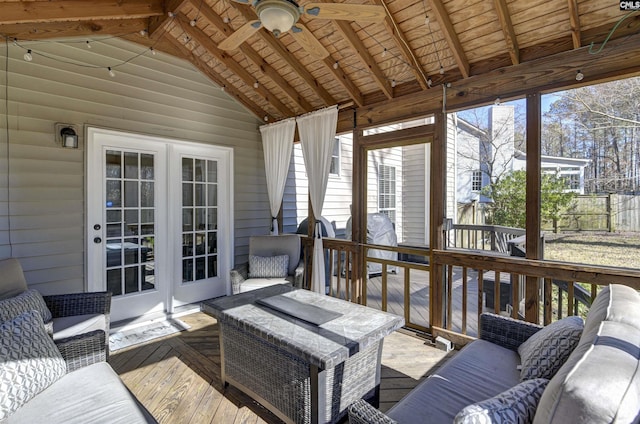 sunroom / solarium featuring wood ceiling, ceiling fan, plenty of natural light, and vaulted ceiling with beams