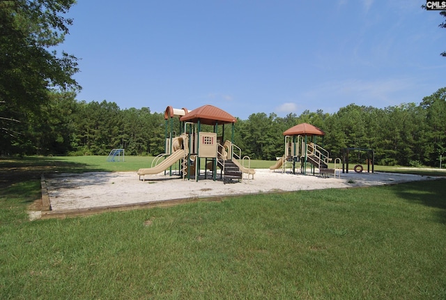 view of playground with a lawn