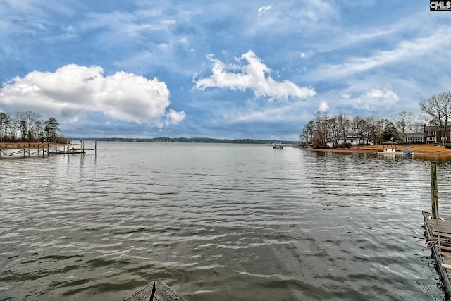 property view of water featuring a dock