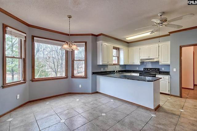 kitchen with hanging light fixtures, ornamental molding, black electric range, and kitchen peninsula