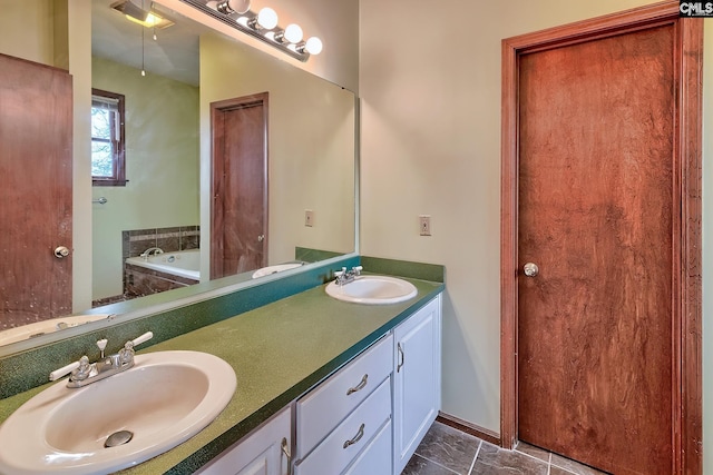 bathroom featuring vanity and a bath