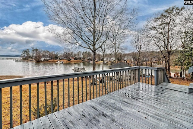 wooden deck with a water view