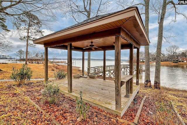 view of dock with a gazebo and a water view