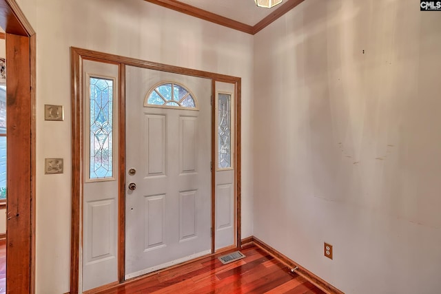 entryway with wood-type flooring and ornamental molding