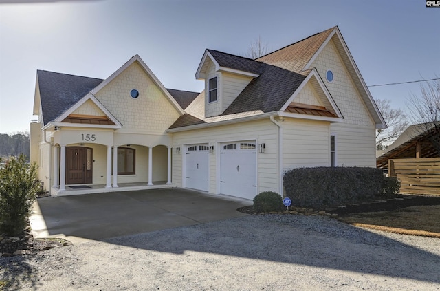 view of front of house featuring a garage and covered porch