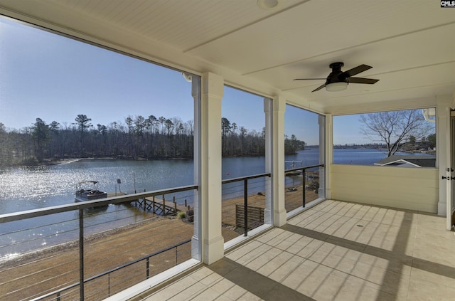 exterior space featuring a water view and ceiling fan