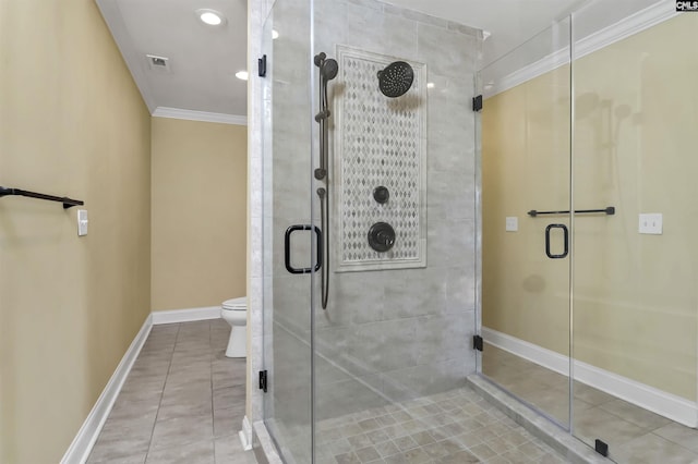 bathroom with crown molding, a shower with shower door, tile patterned floors, and toilet