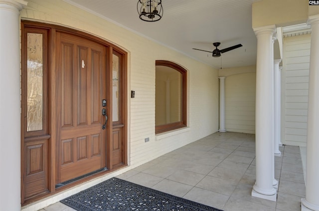 entrance to property with ceiling fan