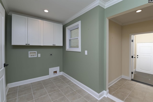 washroom featuring light tile patterned floors, electric dryer hookup, hookup for a washing machine, cabinets, and ornamental molding