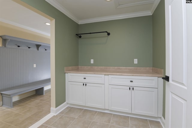 interior space featuring light tile patterned floors and crown molding