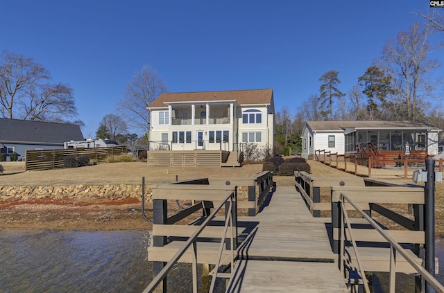 dock area featuring a deck with water view