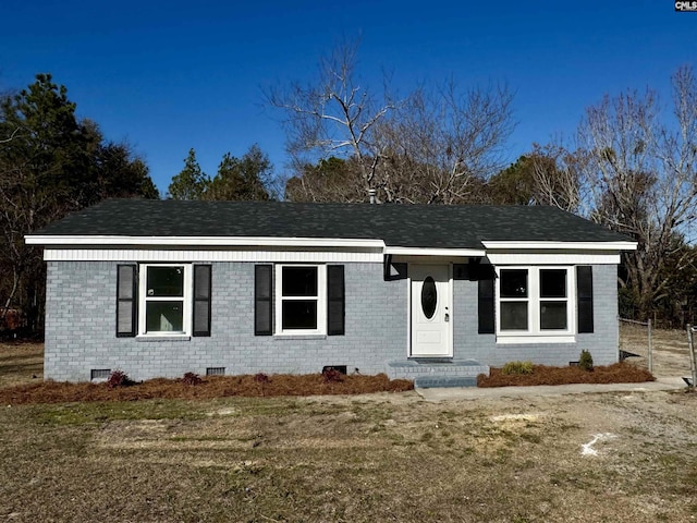 ranch-style house with a front lawn