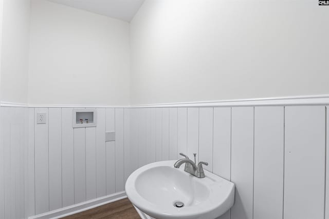 bathroom with sink and hardwood / wood-style floors