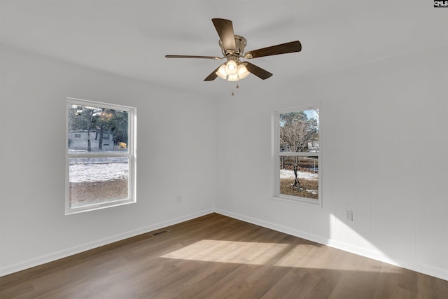 empty room with wood-type flooring and ceiling fan