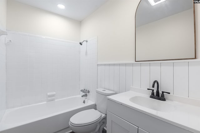 full bathroom with vanity, toilet, and tiled shower / bath combo