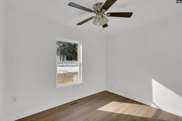 unfurnished room with ceiling fan and dark hardwood / wood-style flooring