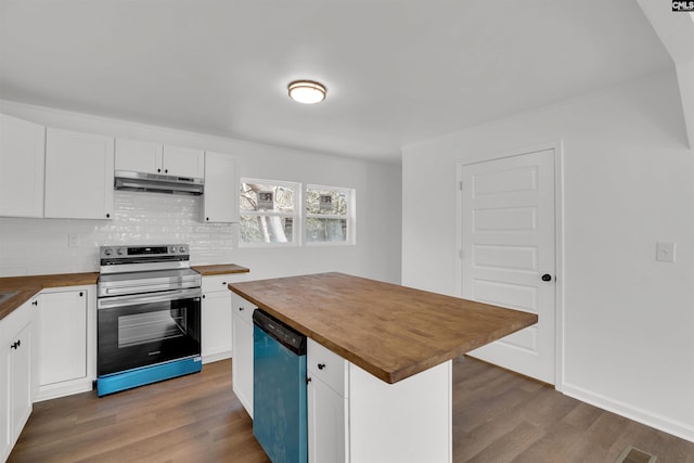 kitchen with stainless steel appliances, dark hardwood / wood-style floors, butcher block countertops, and white cabinets